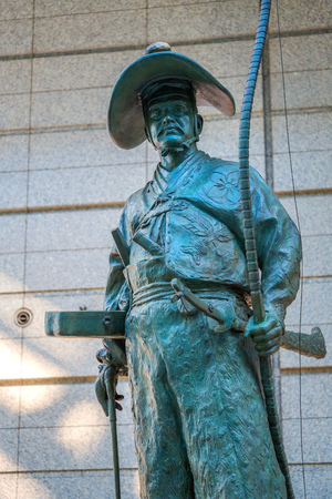 Tokyo, Japan - April 28 2018: Ota Dokan, Japanese samurai who credited with building numerous castles in Kanto area, his statue located on the first floor of Tokyo International Forumのeditorial素材