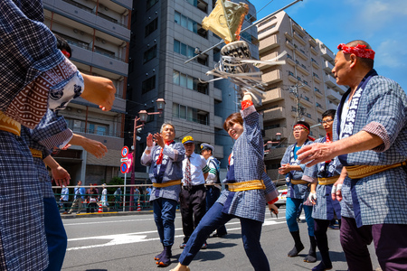 Tokyo, Japan - April 29 2018: Unidentified people parade through a street to Nezu-jinja shrine in Bunkyo Azalea Festival (Tsutsuji Matsuri) which held between early April and early May annuallyのeditorial素材