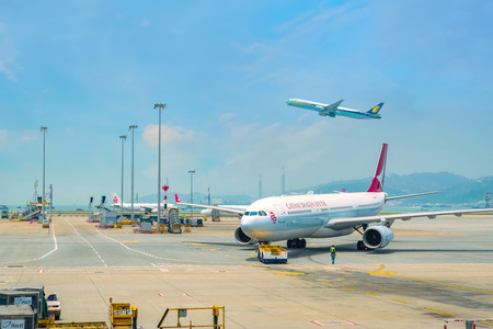 Hong Kong - April 19 2018:  Jet flights dock in Hong Kong International Airport where it's the world's busiest cargo gateway and one of the world's busiest passenger airportsのeditorial素材