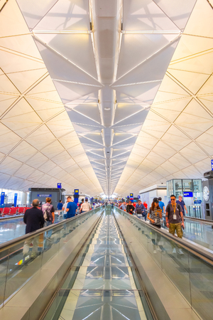 Hong Kong - April 19 2018:  Unidentified people at Hong Kong International Airport where it's the world's busiest cargo gateway and one of the world's busiest passenger airportsのeditorial素材