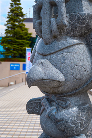 Hirosaki, Japan - April 23 2018: Takamura-kun is a hawk mascot of Hirosaki castle, the design took place at the celebration of the 400th anniversary of Hirosaki castle,  the sculpture located on the foot of Otemon Squareのeditorial素材