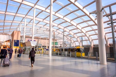 Manchester, UK - May 18 2018: Light rail Metrolink tram in the city center of Manchester, UK. The...