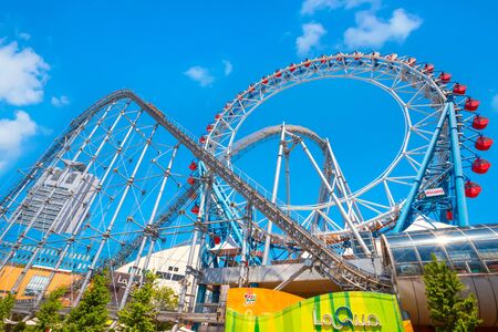 Tokyo, Japan - April 28 2018: Tokyo Dome City includes an amusement park and Tokyo Dome City Attractions occupies the former Korakuen Stadium and includes a roller coaster and a hubless Ferris wheelのeditorial素材