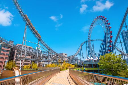 Tokyo, Japan - April 28 2018: Tokyo Dome City includes an amusement park and Tokyo Dome City Attractions occupies the former Korakuen Stadium and includes a roller coaster and a hubless Ferris wheelのeditorial素材