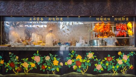 Hong Kong - April 30 2018: People in a food court at Hong Kong International Airport where it's the world's busiest cargo gateway and one of the world's busiest passenger airportsのeditorial素材