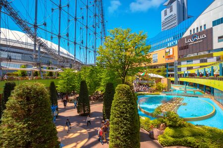 Tokyo, Japan - April 28 2018: Tokyo Dome City includes an amusement park and Tokyo Dome City Attractions occupies the former Korakuen Stadium and includes a roller coaster and a hubless Ferris wheelのeditorial素材