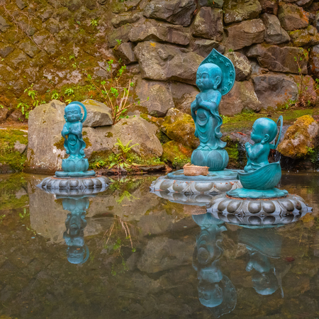 Aomori, Japan - April 24 2018: Buddha statues at Seiryu-ji Buddhist temple founded by Ryuko Oda in 1982, home to largest seated bronze Buddha statue, Showa Daibutsu, in Japanのeditorial素材