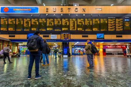 London, UK - May 16 2018: Unidentified people wait for trains at Euston Station which is the...