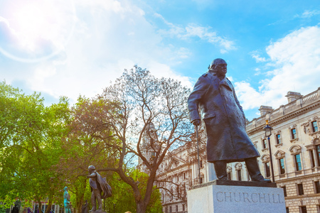 London, UK - May 13 2018: Statue of Winston Churchill at the Parliament Square with other twelve statues of statesmen and other notable individualsのeditorial素材