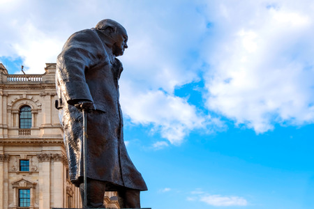 London, UK - May 13 2018: Statue of Winston Churchill at the Parliament Square with other twelve statues of statesmen and other notable individualsのeditorial素材