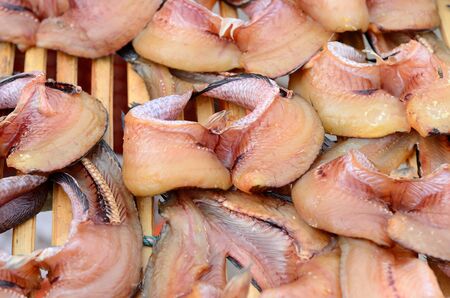 dried sanke headed fish at Thailand marketの写真素材