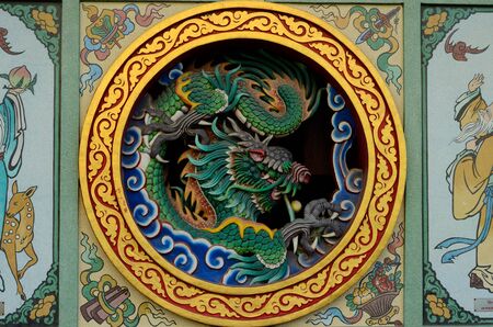 beautiful church dragon wall in Chinese temple of Thailandの写真素材