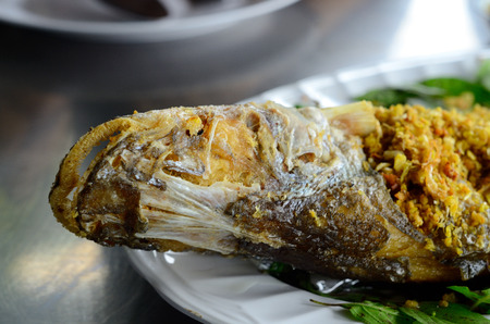 fried fish Sheatfish (Micronema apogon) on table at Thai native marketの写真素材