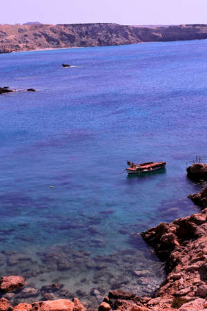 lonely boat in greece island Karpathosの写真素材