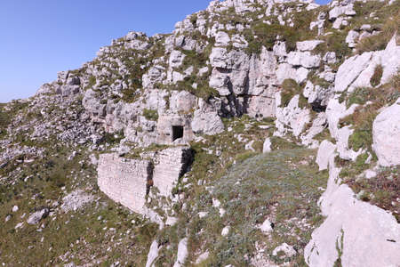 entrance into bunker carved into rockの写真素材