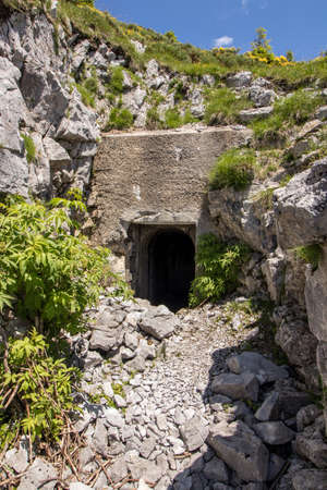 half of entranced into bunker blocked with stonesの写真素材