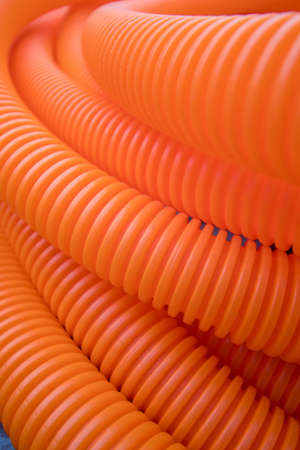 a bunch of orange plastic tubesの写真素材