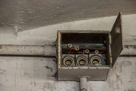 old electrical boxes on wallの写真素材