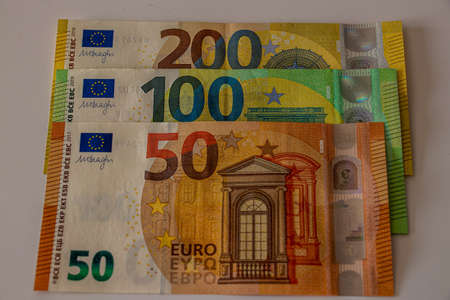200, 100, 50 euro bill on table