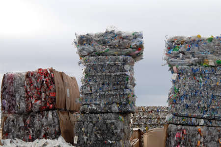 recycle center with bundles of plastic and cansの写真素材