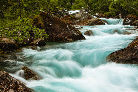 Very beautiful powerful waterfall in Norway with the effect of flowing waterの写真素材