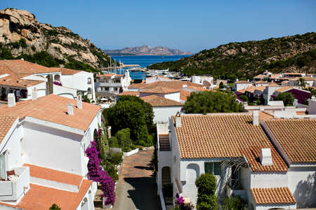 Landscape with rooftops and the sea in Sardiniaの写真素材
