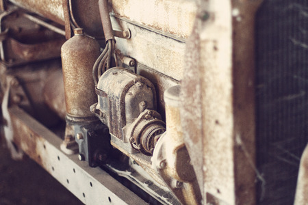 Close up of an old, antique tractor engine, shallow focal lengthの写真素材