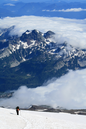Lone mountaineer climbing Mount Rainier in Washington, USAの写真素材