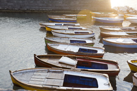 Wooden rowboats anchored in the Bay of Naples at sunset, Campania, Italyの写真素材