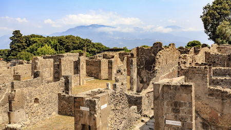Pompeii ruins with mountains in the backgroundの写真素材