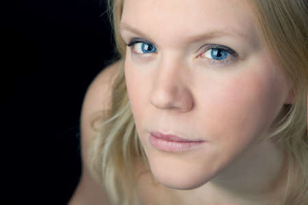 Portrait of a blond woman with blue eyesの写真素材