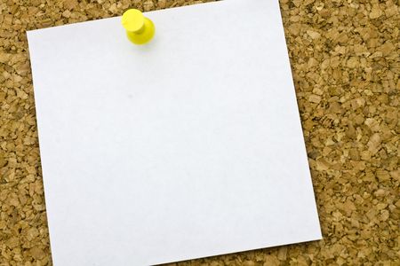 Yellow post-it on a everyday corkboard.の写真素材
