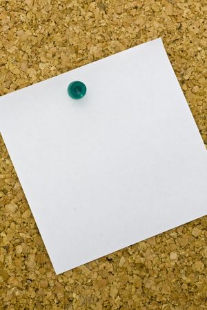 Yellow post it on a everyday corkboard.の写真素材