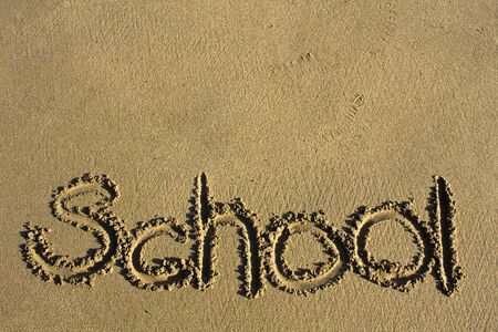 Message says "school" in the Sand on a Beach and texture area upperの写真素材