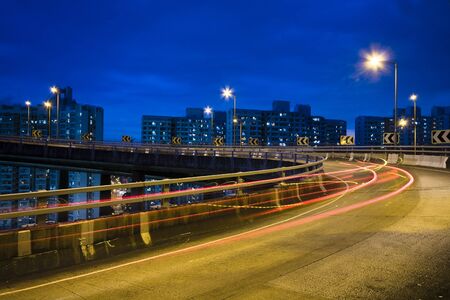 traffic bridge at night in hong kong.の写真素材