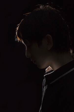Portrait of an Asian man in the darkness for texture の写真素材