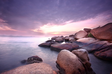 Sea stones at sunset in hong kong.の写真素材