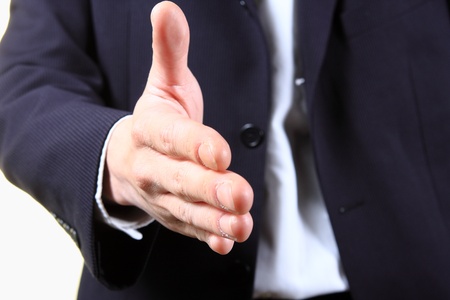 business man with an open hand ready to seal a deal の写真素材