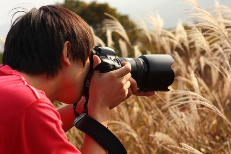 photographer taking photo in country side 
