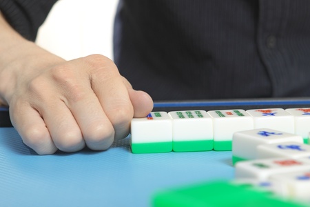 Chinese man play Mahjong, traditional China gamble. の写真素材