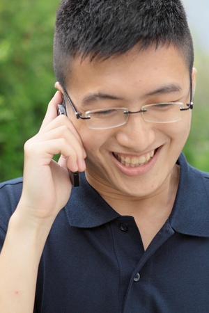 asia man talking on phoneの写真素材