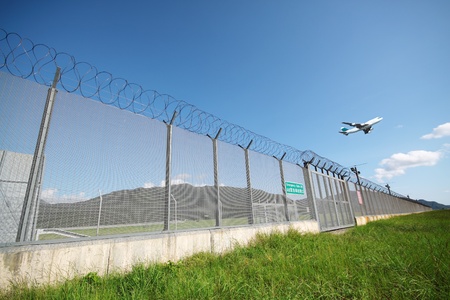 Airplane flying in green airportのeditorial素材