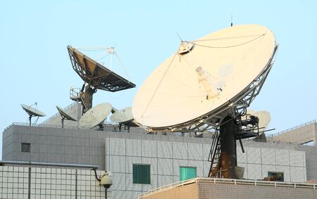 Satellite Communications Dishes on top of TV Stationのeditorial素材