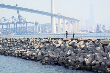 two people walking on breakwaterのeditorial素材