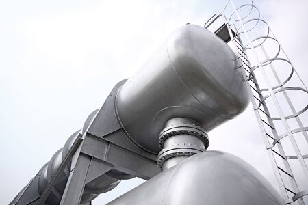 Big gas container against sky の写真素材