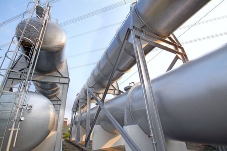 Big gas container against the blue sky の写真素材
