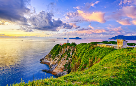 Beautiful lighthouse  landscape in sunrise moment , Hong Kong Hok Tsui Cape D'Aguilarの写真素材