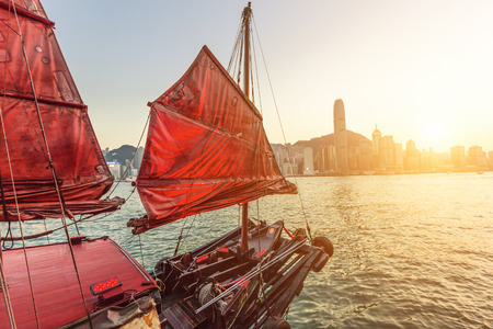 Sailboat In Hong Kong Harbour at sunset.の写真素材