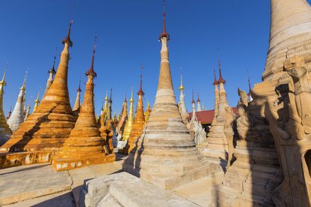Ruins of ancient Burmese Buddhist pagodas Nyaung Ohak in the village of Indein on Inlay Lake in Shan State, Myanmar, Burma)の写真素材