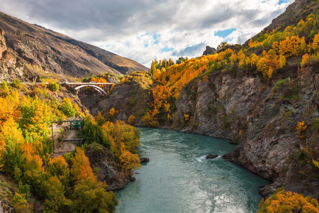 Wooden historic bridge over the shotover river, Queenstown, New Zealandの写真素材